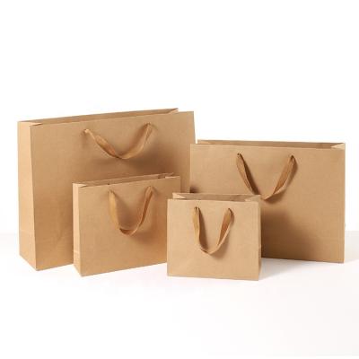 China Recyclable Wholesale Custom Logo Craft Kraft Paper Shopping Paper Bag Brown White Black Gift for sale