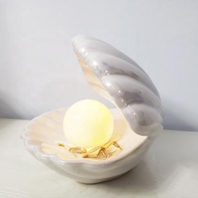 China Modern Ceramic Bedside Decorative LED Bedroom Living Room Pearl Shell Lamp Table Lamp Modern Night Lamp for sale