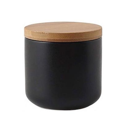 China Viable Wholesale Black Ceramic Sugar Bowl With Wooden Lid Sugar Storage Jar Pot for sale