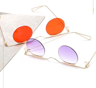 China Fashion Sunglasses New Trend Unique Women's Round Lens Rimless Charming Sunglasses for sale