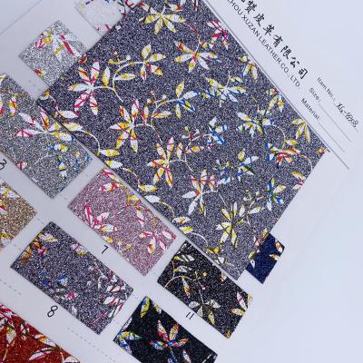 China New design waterproof printed glitter vinyl fabric for bows vinyl printed faux glitter roll leather glitter wholesale designer inspired faux l for sale