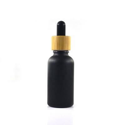 China Personal Care 1oz Frosted Matte Black Glass Bottle For CBD Oil Essential Oil Glass Dropper for sale