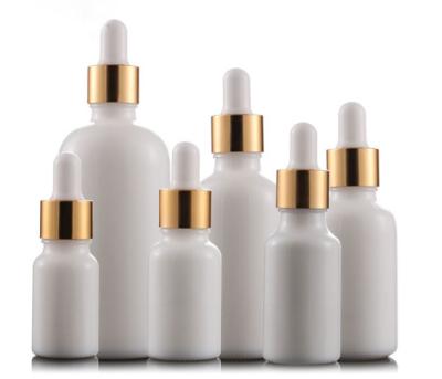 China Personal Care Glass Bottle Manufacturer 30ml White Porcelain Bottle With Gold Lid for sale