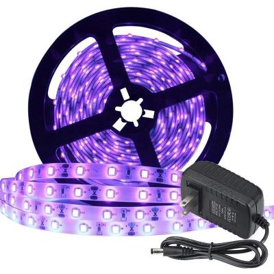 China Home Decoration 5M 3528 DC12V 60LEDS/M Waterproof Flexible UV Black Light Led Strip Light With 2A Power Adapter for sale