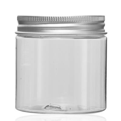 China 100g Unique Transparent Round Cosmetic Colorful Caps Wide-Mouth PET Cosmetic Plastic Jars With Lid for sale