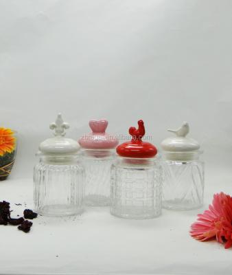 China Different Model Viable Mini Storage Glass Jars Containers With The Decorative Ceramic Lid for sale