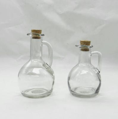 China Viable Clear Glass Olive Oil and Vinegar Bottles with Glass Handles and Cork Lids for sale