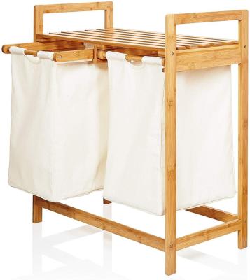 China Minimalist Bamboo Wooden Double Laundry Hamper Laundry Sorter Basket With Bags for sale