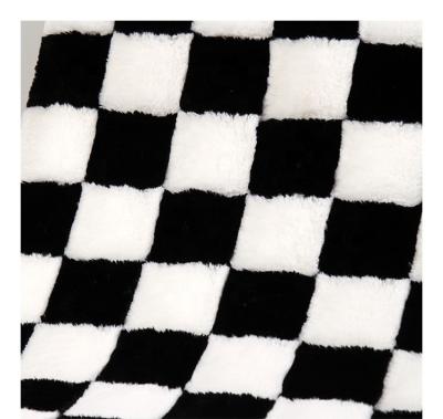 China Brush Flower Grid Luxury White Black Jacquard Artificial Rabbit Fur Fabric Manufacturer for sale