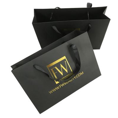 China New Gold Foil Hot Stamping Black Matt Logo Recyclable Paper Bag With Ribbon Handles for sale