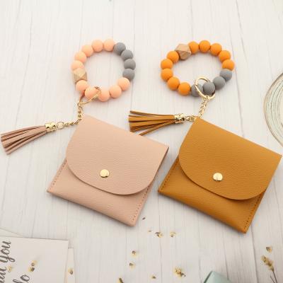 China Custom Logo Leather Tassel Bangle Wristlet Promotional Gifts Souvenir Gifts Key Chain Women Silicone Beaded Wooden Beaded Wallet ID Credit Cards for sale