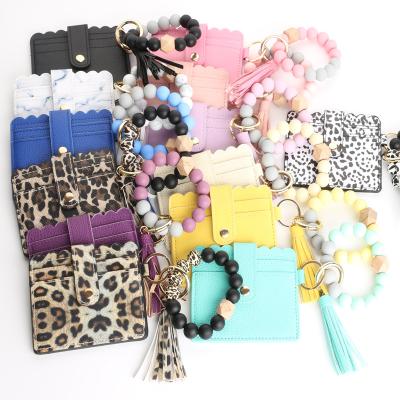 China Credit Cards Leather Wooden Beaded Wallet ID Silicone Women Key Chain Wristband Wristband Souvenir Gifts Promotion Tassel Key Chain for sale