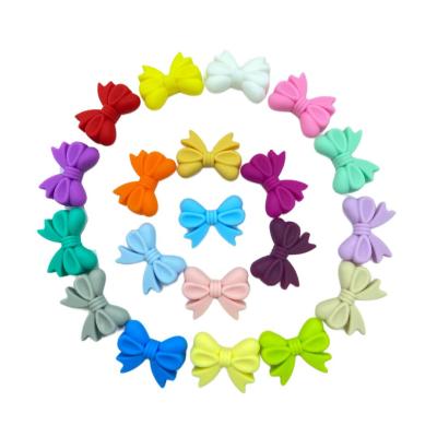 China High Quality Soft Toy Food Grade BPA Free Colorful Bowknot Beads Flower Shape Beads Silicone Beads For Jewelry Making for sale