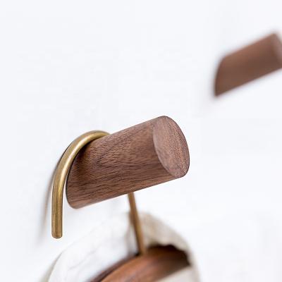 China Sustainable Solid Wood Hangs Coat Hook Black Walnut Door Hooks Creative Wood Railless Sticky Beech for sale