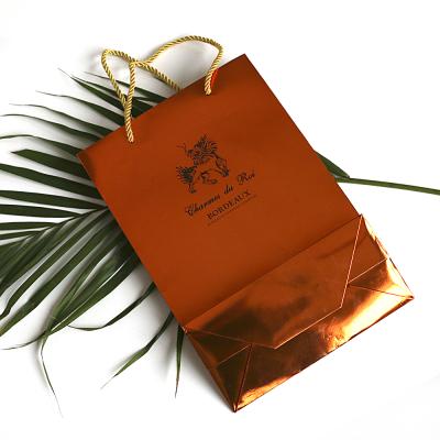 China Good Quality Recyclable Brown Wholesale Luxury Shopping Paper Bag Customized Kraft Paper Bag Printing for sale