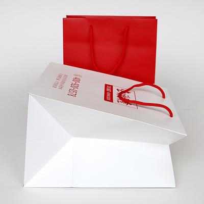 China Recyclable Paper Shopping Bag , Custom LOGO Printed Square Bottom Paper Bag for sale