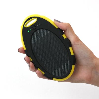 China Mini Phone Solar Charger 4000mAh Portable Solar Panel Charging Solar Power Bank with Dual USB Outputs for sale