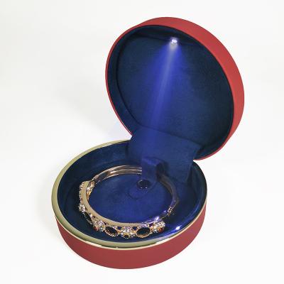 China PU+Velvet OEM ODM Round Leather Wedding Gift Box PU Ring Bracelet Jewelry Packaging Pendant Box With Led Light for sale