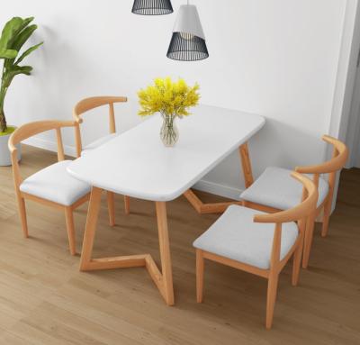 China Stable simple Nordic wooden dining table and 4 person chair combinations for sale