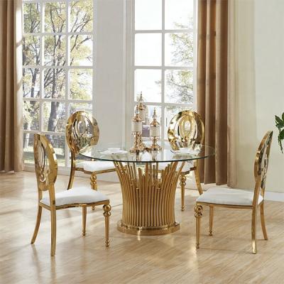 China Re-A303 Modern Glass Round Gold Dining Table 6 Chairs Set for sale