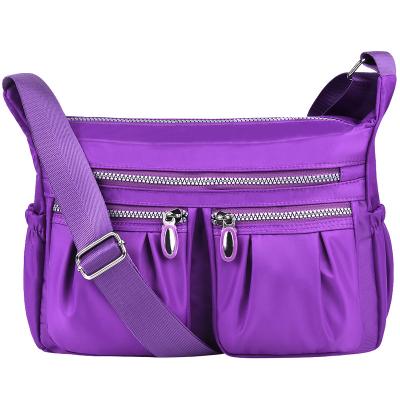 China 2022 Fashion Waterproof Women Shoulder Bag 2022 High Quality Casual Handbag Luxury Nylon Clips Ladies Purple Cross - Body Bag for sale