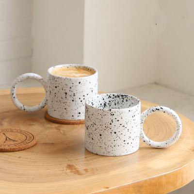 China Viable Dirty Matte Ink Splashing Beast Big White Round Handle Big Ring Ceramic INS Dot Spray Coffee Mug Ear Mug for sale