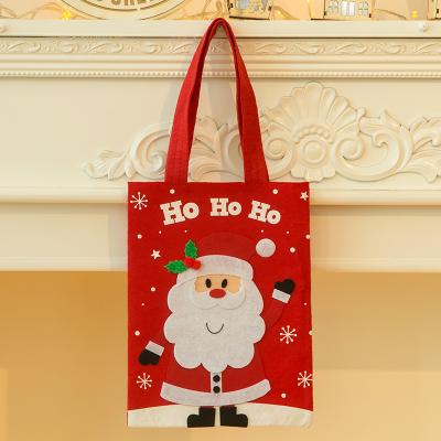 China Eco-friendly Christmas Ornaments Funny Cartoon Sticker Cloth Handbag Kids Gift Candy Bag Gift Bag for sale