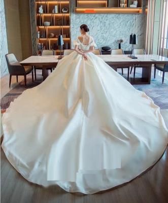 China Anti-Static Women Ball Gown Bridal Tail Dress With Puff Sleeve Drop Shoulder Elegance Wedding Floor Length Dress for sale