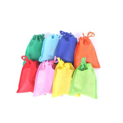 China Biodegradable Compostable Nonwoven Bag With Pouch Pla Nonwoven Drawstring Carry Packaging Bags With Logo for sale