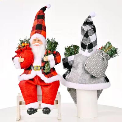 China Gift Amazon Hot Sale New Resin Christmas Toys With Pine Leaves Santa Claus Sitting Position Doll for sale