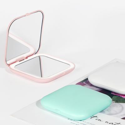 China New Portable Super Slim Shape Lighted Rechargeable Folding Led Lighted Makeup Travel Mirror for sale