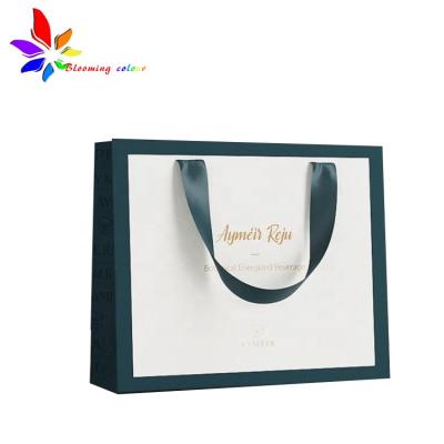 China Recyclable Fashion Custom Design Apparel Packaging Bag Create Your Own Brand Paper Bag for sale