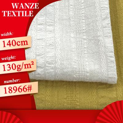 China Breathable Cotton 100 Gauze Yarn Dyed Jacquard Shirt Fabric Bubble Hollow Band Cotton Woven Pajama Fabric for sale