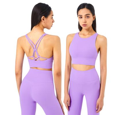 China Breathable popular bra and sports underwear set cross back yoga bra ties back halter sports bra for sale