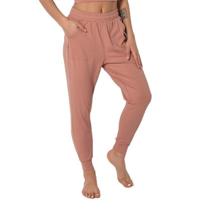 China Women's Breathable Casual Loose Sports Pants And Trousers Stacked Joggers Running Pants With Side Pockets for sale