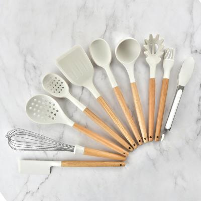 China Sustainable cookware sets wooden kitchen cookware set handle silicone kitchenware for sale