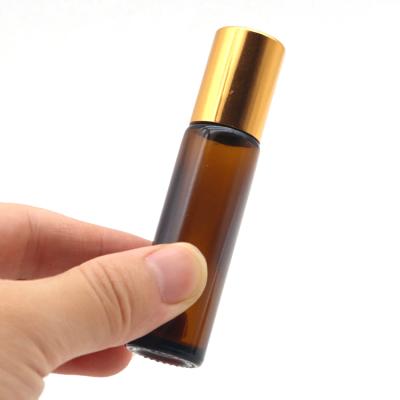 China Essential Oil Essential Oil Use 10ml Amber Roll On Glass Roller Bottle With Rollball And Gold Cap for sale