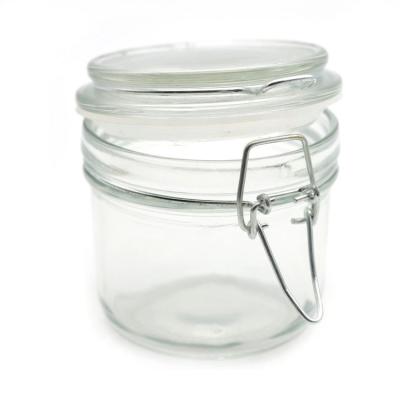 China 200ml Round Glass Storage Jars Sealable With Clear Bail Clamp And Metal Trigger Lids for sale