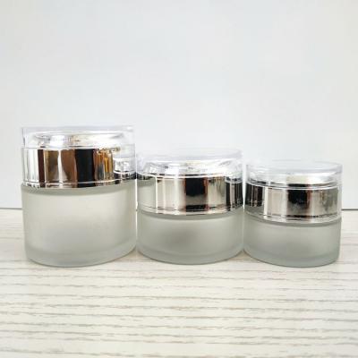 China Skin Care 20G 30G 50G Gel Glass Cream Cream Jar With Lid 1oz Silver Glass Cosmetic Container Cream Jar 30g Cosmetic Glass Jar With Acrylic Cap for sale