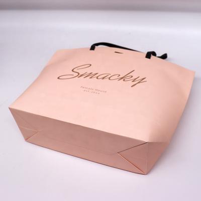 China Recycled Materials Custom Luxury Shoes Clothes Kraft Paper Bags Printed Logo Custom Packaging Paper Bag Clothing Shopping Gift Jewelry for sale