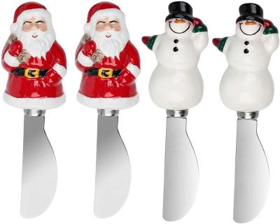 China Sustainable Santa Claus Snowman Design Handle Condiment Knife Set of 4 Piece Stainless Steel Christmas Butter Cheese Spreaders for sale