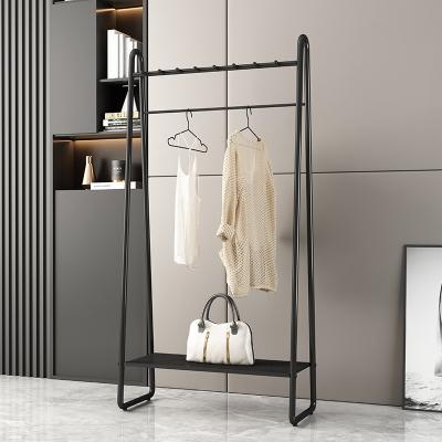 China Newly iron art design nordic clothes rack simple iron modern art hanger bag floor bedroom household coat rack for sale