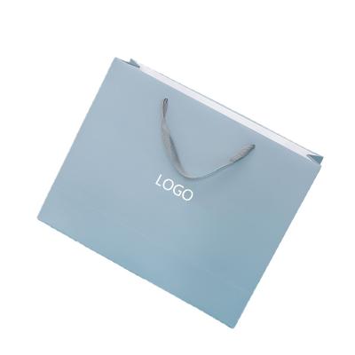 China Handmade Luxury In Stock Landscape Portrait Eco Kraft Paper Gift Bags Various Sizes Colors for sale