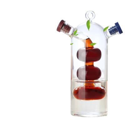 China Sustainable 2 in 1 oil and vinegar separator kettle Glass creative leakproof glass oil  flavoring bottle for sale