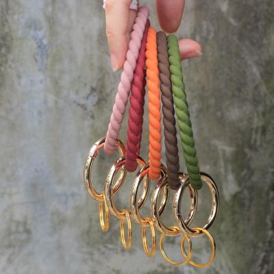 China Key Holder Custom Designs Bracelet Key Chain Ring Silicone Rubber Pop Key Bracelet for sale