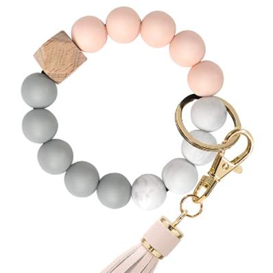 China Custom Key Holder Silicone Wrist Band Key Chain Circle Beads Round Wristband Rubber Wristband Keychain for sale