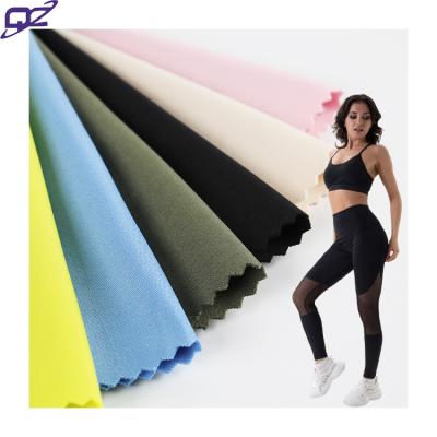 China Anti Pill Army Green Customer Color Sports 4 Way Stretch 90/10 DTY Polyester Spandex Knitted Interlock Fabric For Sportswear Yoga Suit for sale