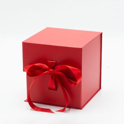 China Recycled Materials Like Ribbon Style Red Custom Cube Folding Gift Box Packaging For Small Business for sale