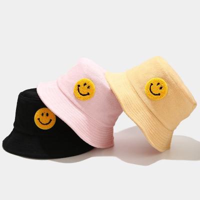 China Cloth casual fisherman's towel hat for men and women big face logo basin foldable hat sun bucket smile outdoor hats for sale