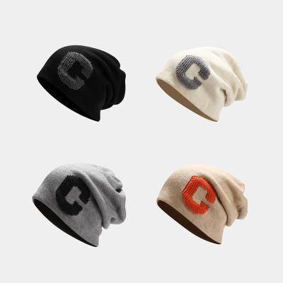 China Autumn And Winter Big Head JOINT letter C loose hats winter pile hat trend male youth female Ear-protection cold man knitting hat for sale